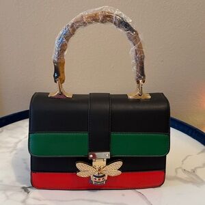Elegant Black, Green, and Red Handbag